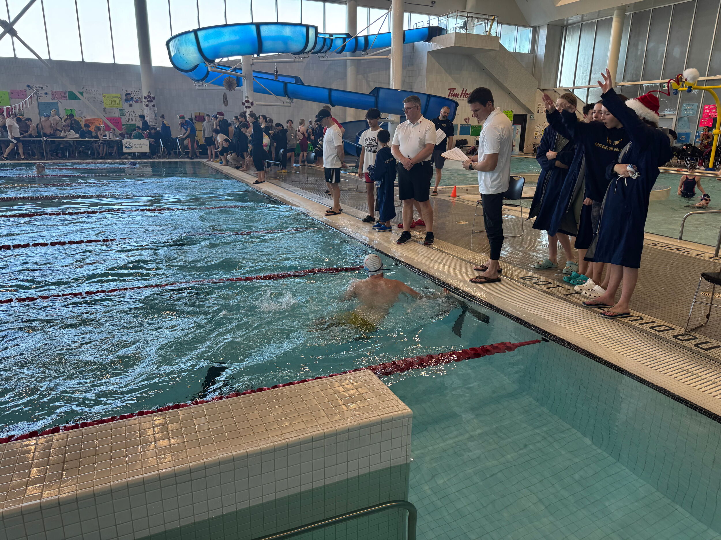 Cape Breton Dorados swimmers supporting a teammate