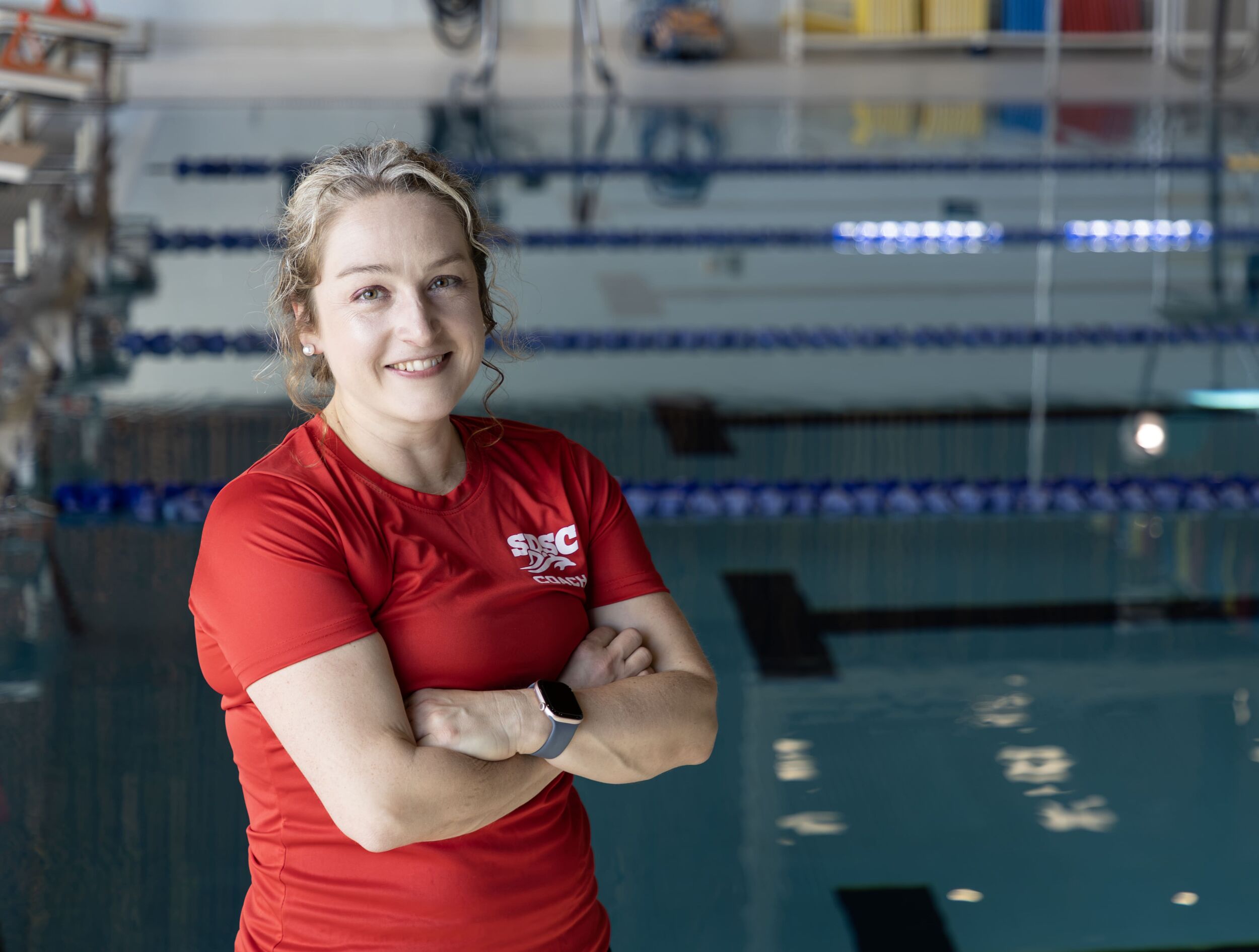 Headshot of Jill LeBlanc, Assistant Coach with pool in background